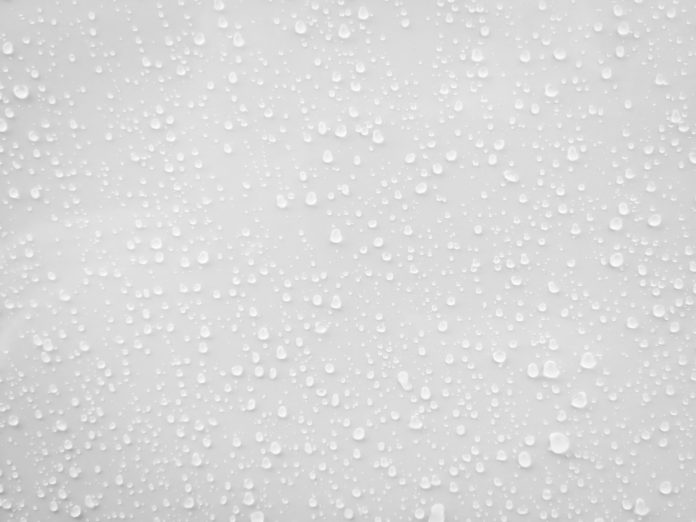 Watershock in new builds: Concern over moisture loads and ventilation in housing Water drops on white surface background, representing watershock in new builds