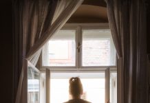 Wolverhampton City Council greenlights £1m space for domestic abuse victims woman looking out window of accommodation - domestic abuse victims