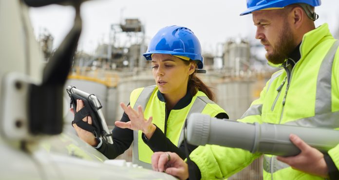 Coordinate your field and office teams with OpenSpace Capture site engineers at petrochemical plant using technology, representing openspace capture