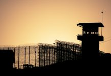 Kier, Laing O’Rourke and Wates score £225m MoJ contract Silhouette of barbed wires and watchtower of prison in Neapolis, Crete, at sunset