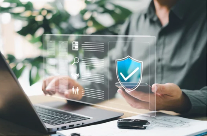 The role of retrospective defects insurance: A bridge to property sale Image of worker using computer representing retrospective defects insurance