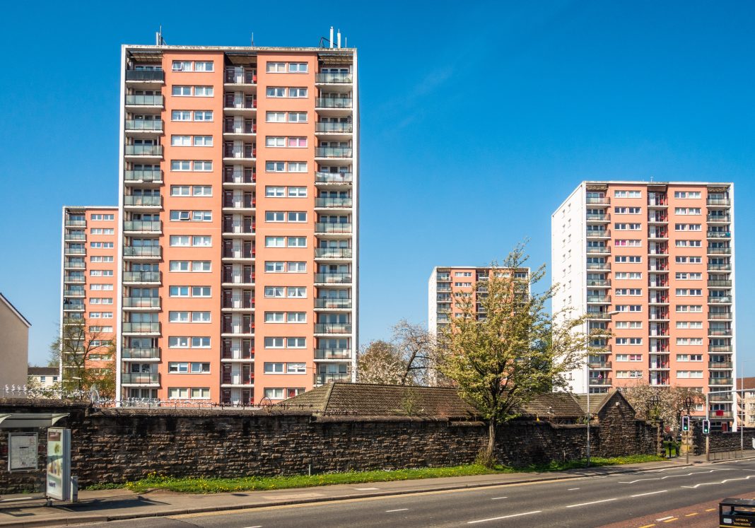 A group of tower blocks in Maryhill, Glasgow during spring, representing better building information management