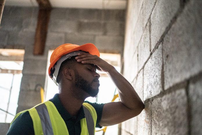 construction output - sad construction worker