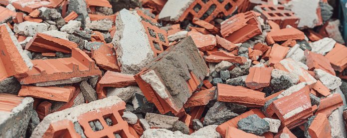 M-AR and Biffa partnership to drive manufacturing waste reduction Construction debris red brick from demolished building wall in waste dumpster closeup Biffa will assist M-AR Offsite in driving waste reduction, reusing or recycling all of their waste generated in manufacturing and construction