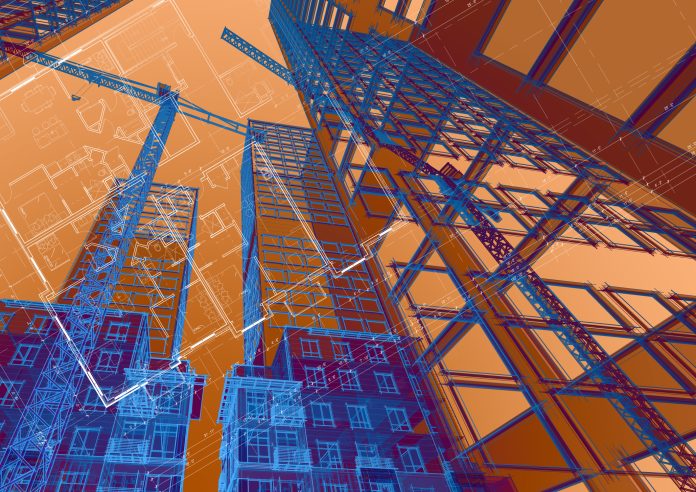 Construction cranes building a new residential development, representing the built environment