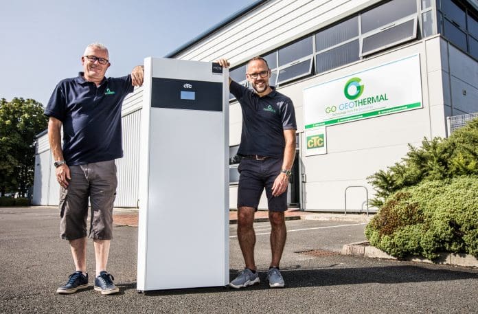 Go Geothermal Director Sean Sowden (right) with Technical Manager Alan Brooke outside the new office/warehouse with a CTC heat pump.