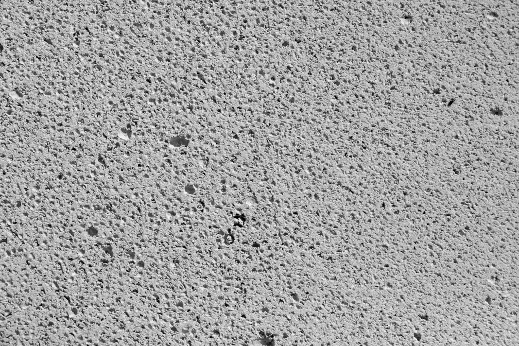 Autoclaved aerated concrete. Gray background close up texture, representing RAAC