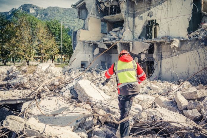 DORCE: Providing emergency modular housing in Turkey Rescuer search trough ruins of building