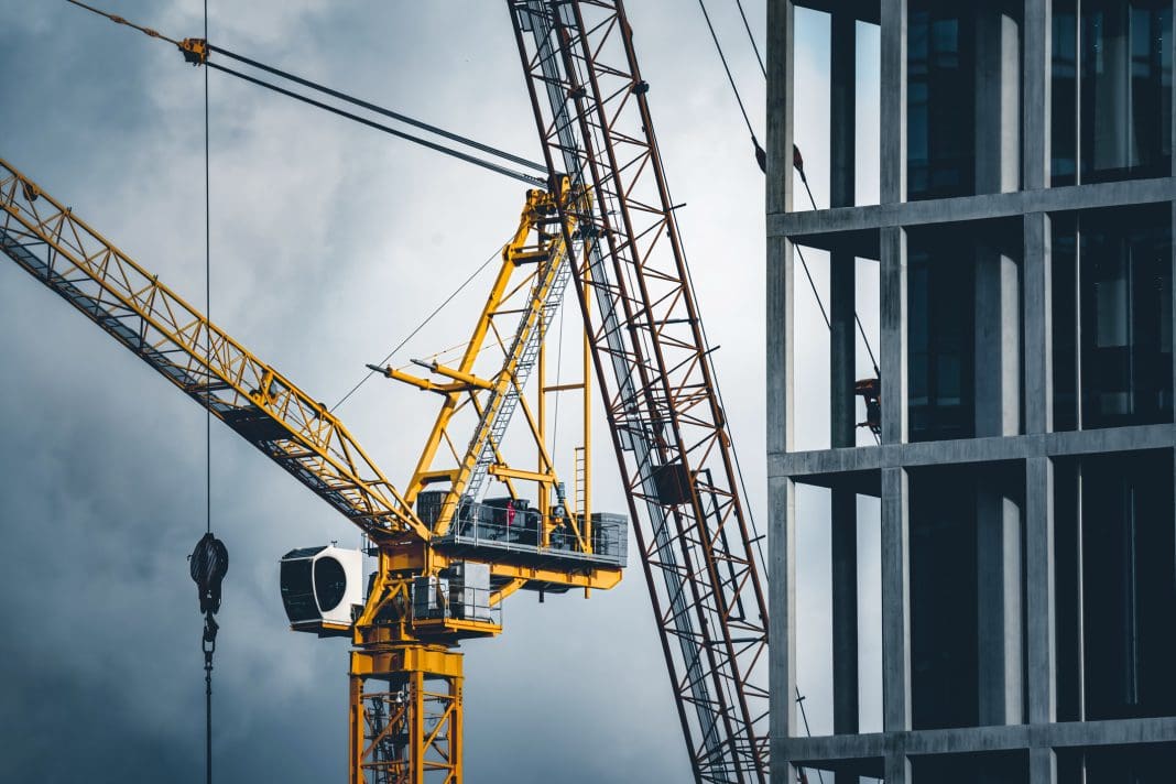 September PMI data saw a sharp decline in construction output, with a housebuilding slump, declining new orders and low expectations to blame. image: Construction tower cranes on a building site