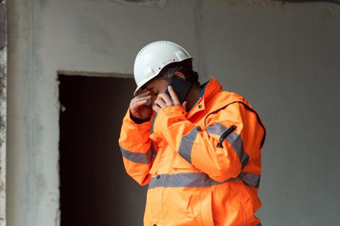 silent discrimination - unhappy construction worker