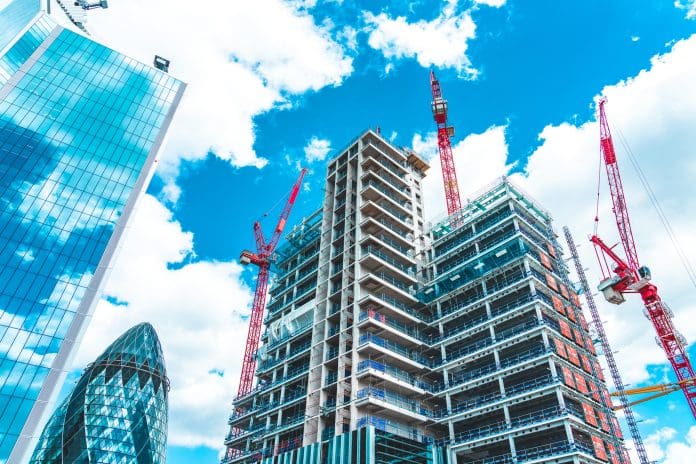 Implementing modular integrated construction in high-rise high-density cities Construction Site in London City, representing modular integrated construction