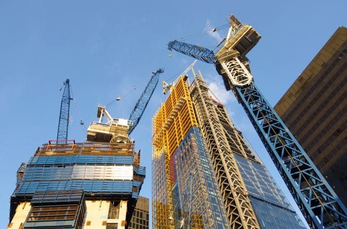 Build Warranty® – building trust: high-value schemes ensuring maximum project security low view of the cranes to build new skyscrapers in the City of London