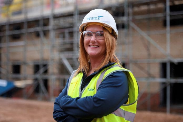 WATES STEM returners programme illustrated through woman wearing hard hat
