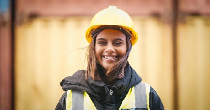 Shot of a young woman wearing a hardhat at work Shot of a young woman wearing a hardhat at work