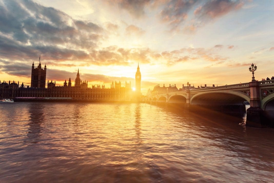 Houses of Parliament and Westminster Bridge at sunset in London, United Kingdom, representing the lack of political discussion on clean heat