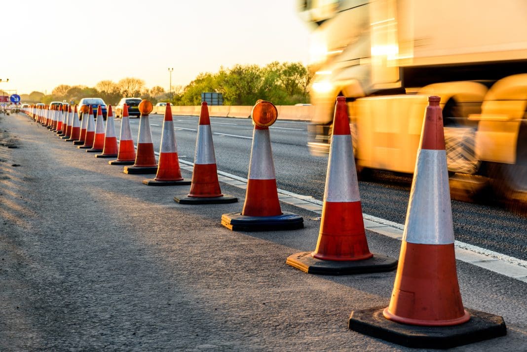 Evening view UK Motorway Services Roadworks Cones, representing the highways maintenance contract