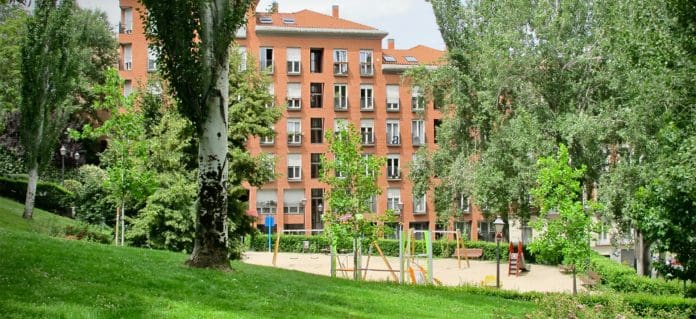 Image of block of flats in green space, city centre planning