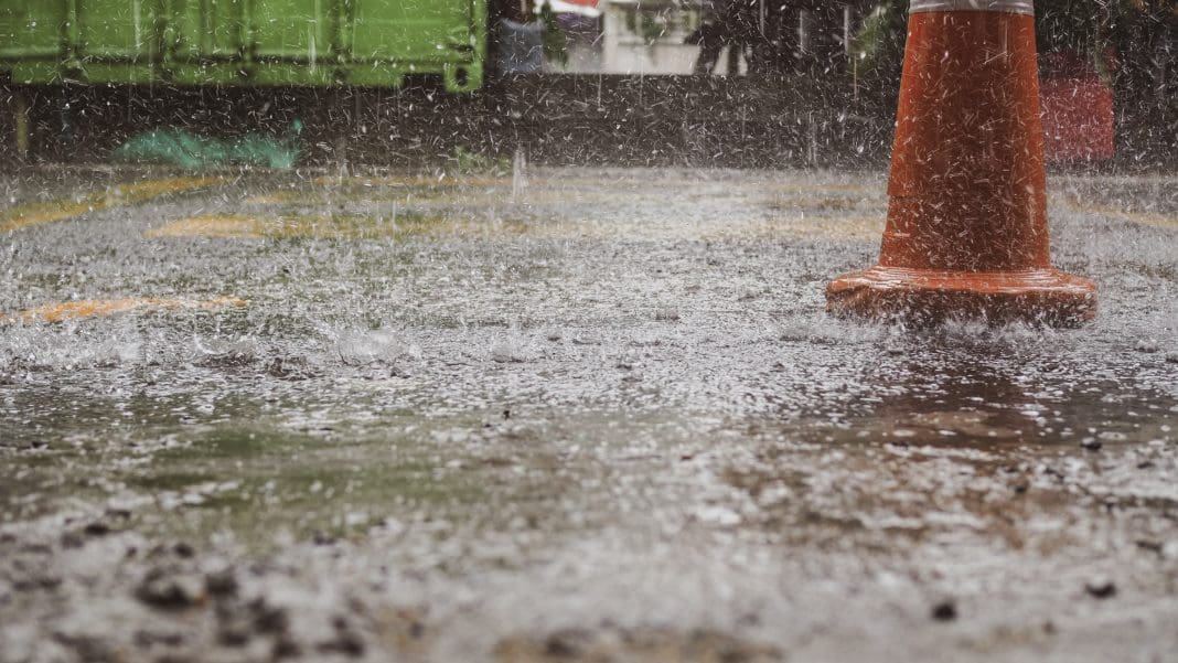 Closeup of heavy raindrops at a construction site.