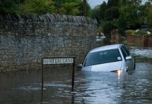 SuDS, SABS and statutes: How England can tackle its surface water problem car drives into verge in 3 ft of water, 43mm of rain in one day, 20th July 2007, Oxfordshire, England.
