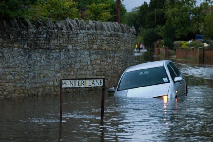 SuDS, SABS and statutes: How England can tackle its surface water problem car drives into verge in 3 ft of water, 43mm of rain in one day, 20th July 2007, Oxfordshire, England.