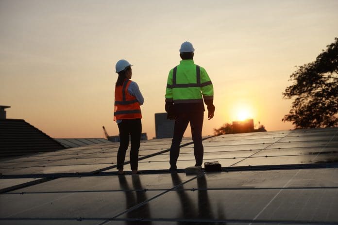 Silhouette Site Solar service engineer team working on a solar rooftop against the sunset The acquisition of Redrow will cement Barratt's position as the biggest homebuilder in the UK, as Barratt-Redrow plc