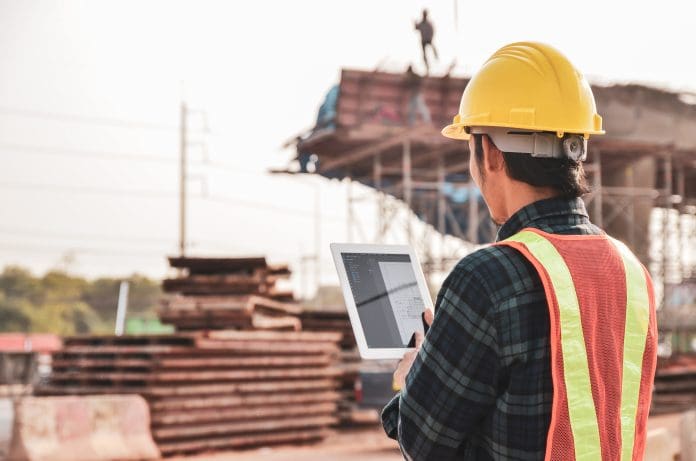 man wearing hardhat on construction site