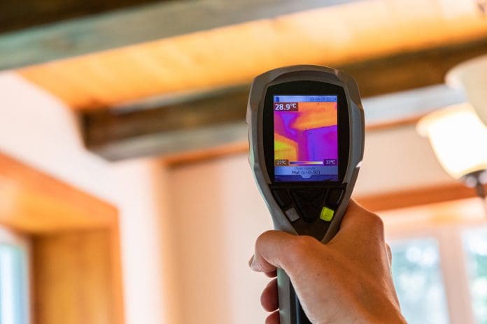 Actis to showcase Part L CPD at LABC’s virtual Welsh roadshow An infrared thermal imaging device is seen in use, close up during an indoor environmental quality and regulation assessment, with copy space.