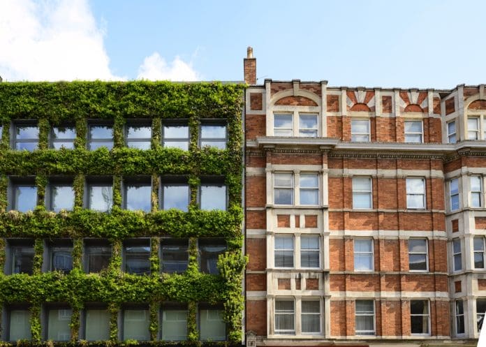 Vertical garden on modern building contrasts with red brick in Bloomsbury, London