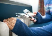 Wondrwall launches Energy Service Contracts (ESC) for newbuilds Man's cold hands in warm sweater on radiator in winter. Energy crisis concept representing Energy service contracts