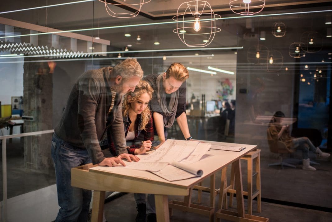 Team of architects working on a new business projects. New research into public perceptions of professionalism among architects shows that architects are believed to operate to a high standard