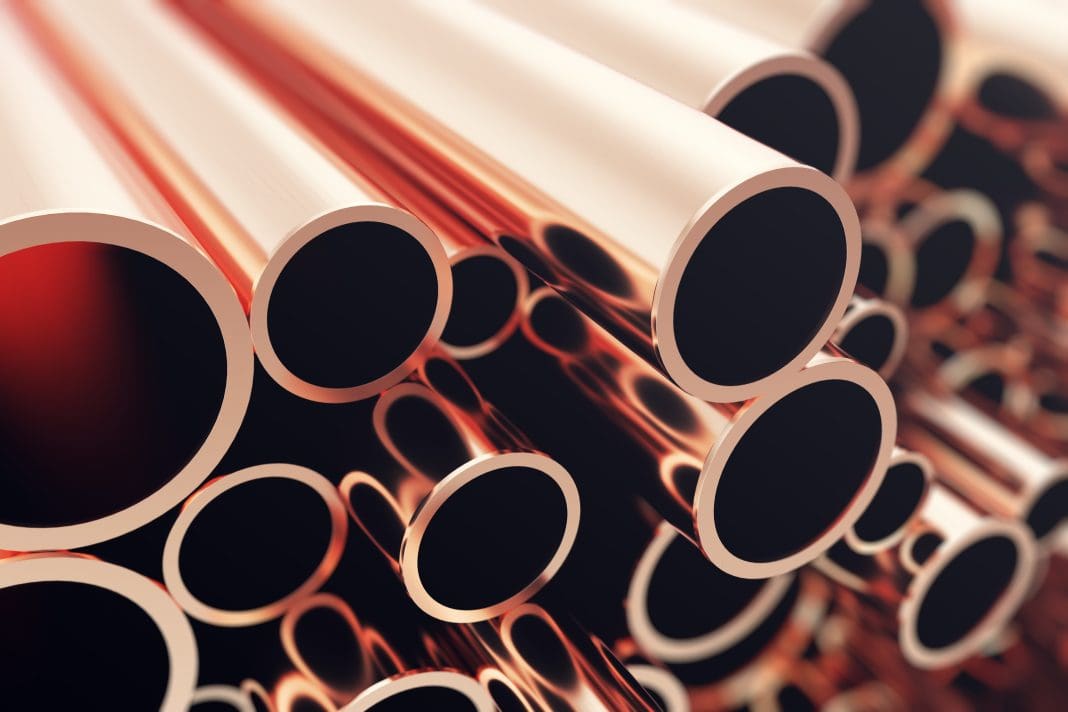 Industry business production and heavy metallurgical industrial products, many shiny steel pipes, industrial background, manufacturing business production concept, copper pipes with selective focus effect. 3D illustration.