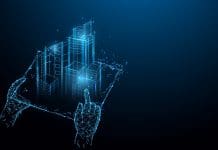 Digital Construction Today: Get the global view on BIM, digital twins, AI, IoT and much more Hands holding blue print with architect form lines, triangles and particle style design. Illustration vector