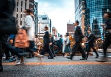 How the public sector can boost efficiency and value through technology Crowd of business people on their way from work. They are unrecognisable. Long exposure shot.