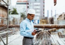 6 reasons small businesses get big benefits from construction software Successful engineer working at construction site working on digital tablet