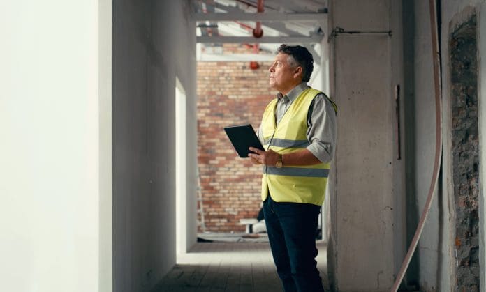 Construction site, project management and man planning tablet ideas, architecture vision and industrial logistics on property building. Engineering contractor, digital development and tech innovation Construction site, project management and man planning tablet ideas, architecture vision and industrial logistics on property building. Engineering contractor, digital development and tech innovation representing MMC