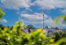 UK construction sector ends 6 month decline, shows March recovery Mobile construction crane in the private sector in Germany.