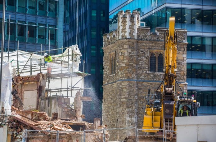 City of London construction site with excavators and old church Build Warranty looks at the key issues facing the construction industry in 2024 and how they are rising to the challenges