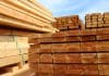 Emerging trends in sustainable construction materials and how to prepare for them Photo showing some huge piles of wooden planks and fence posts, freshly sawn up in a sawmill and piled in the timber yard, ready to be sold to the general public.