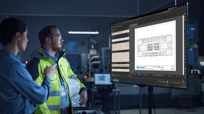 workers in hi-vis jacket looking at a computer streen in the dar, representing AI in AECO
