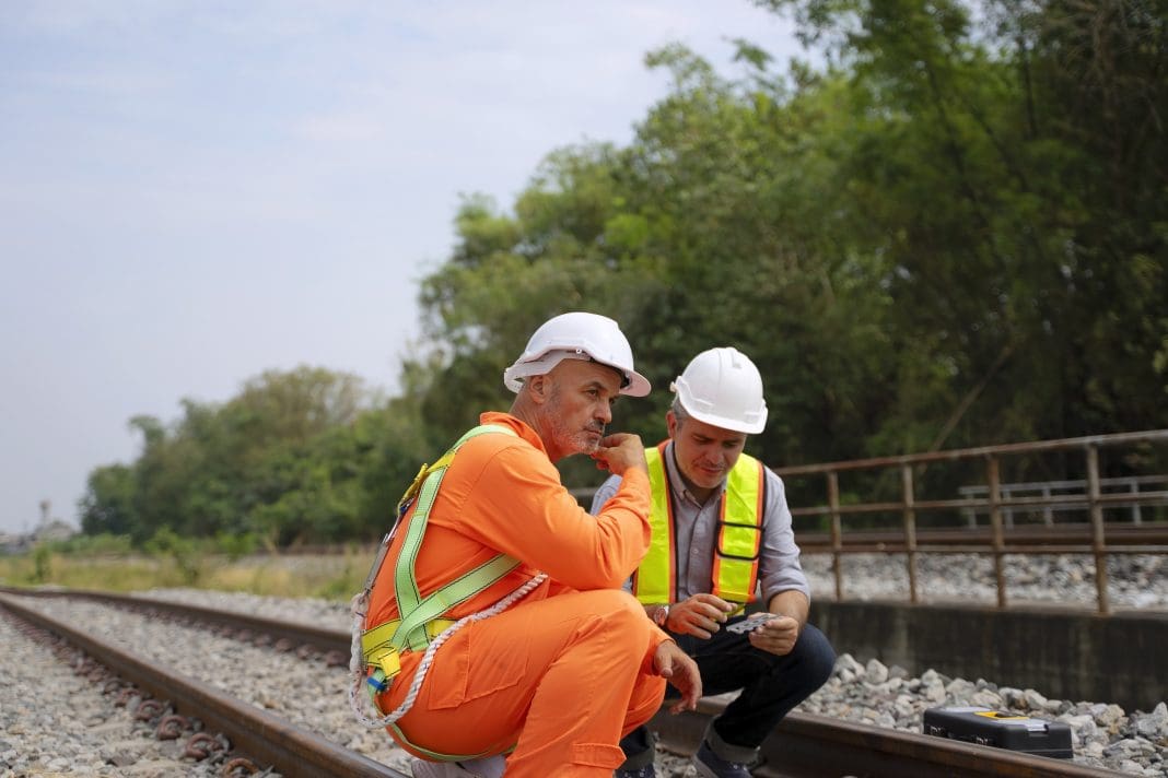 Two engineer are working on the rail train. Engineering, According to industry sources, Keltbray's infrastructure business will be sold and led by current chief executive Darren James