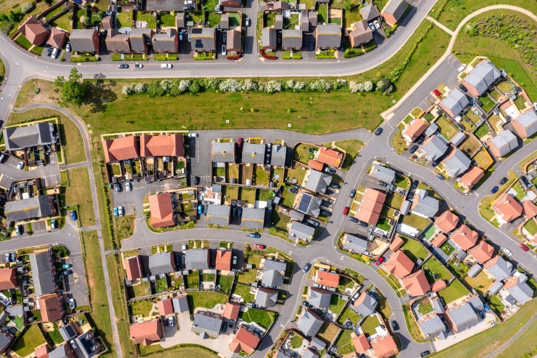 Aerial view of English new estate LHC Group's Clive Feeney, examines the pledges made in the new government's first King's Speech and how they could impact UK construction