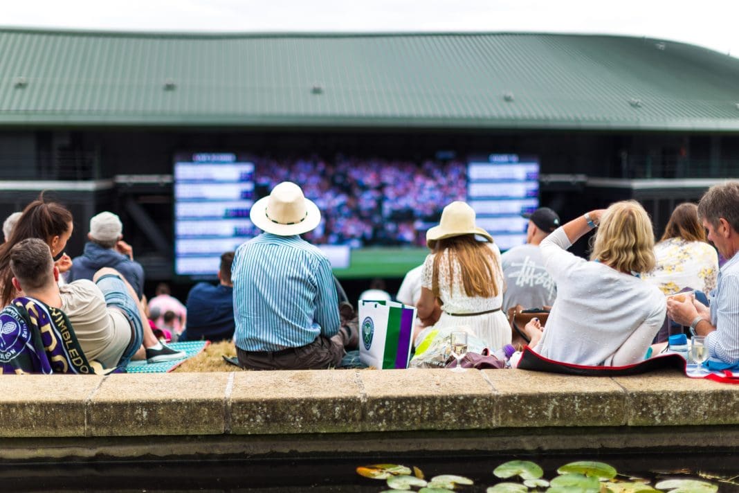 Crowd of people enjoying tennis on the hill, Wimbledon, UK Wimbledon tennis court, which is set for an expansion