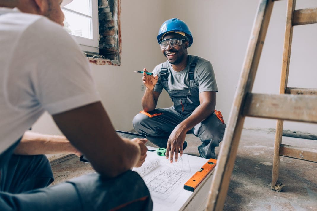 Two Construction Workers Working Together on an Apartment Renovation Planning reform is needed to stop projects from being delayed