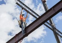 Skills shortage could be allayed by offsite steel frame construction A worker erecting a steel frame construction, the kind Intrastack encourages offsite construction of