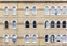 UK retrofit delivery models: Call for clarity in the face of fragmentation Georgian style apartment with arched windows around Elephant and Castle area in south London, representing retrofit models