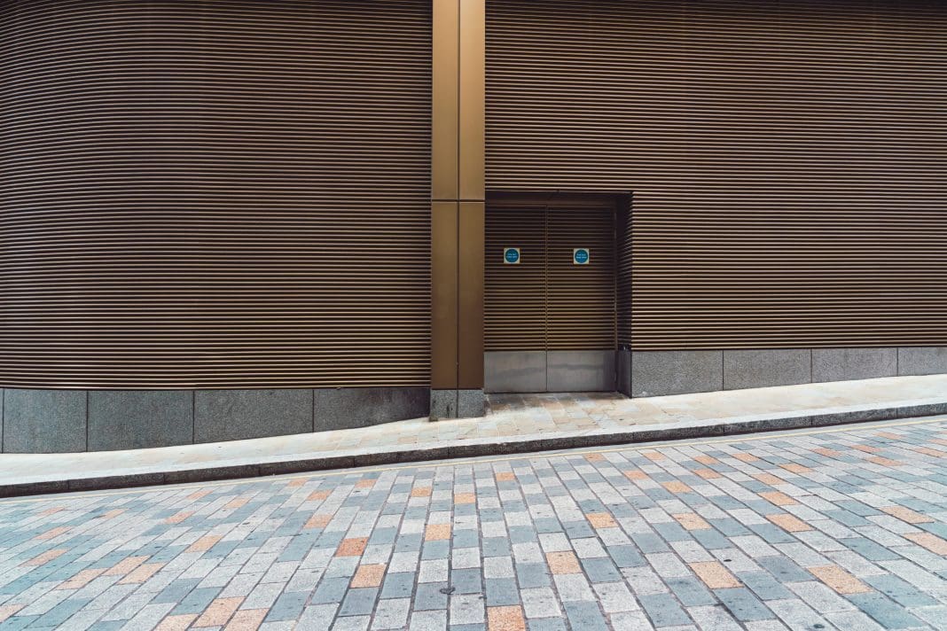 Modern metal fire exit door on the street Boyd Group inspects 75 fire doors using cohesive and integrated DorTrak software from Fireco