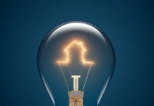€5m funding to Construct Innovate for housing research A close up of a lightbulb with a filament in the shape of a house representing Construct Innovate's research into housing