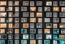 Research into noise pollution highlights need for changes to the fabric of buildings in the UK The light in an apartment at night, Canary Wharf, London
