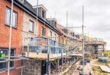 Explore the future of house-building at BEYOND ’25 LIVE Scaffolding surrounding new homes at a development in n Cambridgeshire, South-East England, as will be covered in NHBC's BEYOND '25 LIVE