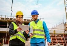 Key leadership appointments drive innovation and social impact at national construction framework provider Construction workers Using Digital Tablet on a construction site